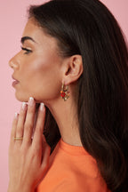 Earrings with various dangling beads